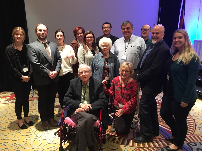 Former Littleton Independent editor Garrett Ray, front, poses for a photo with some of the staff of Colorado Community Media during the Colorado Press Association convention in Colorado Springs on April 14. Ray was inducted into the CPA Hall of Fame.
